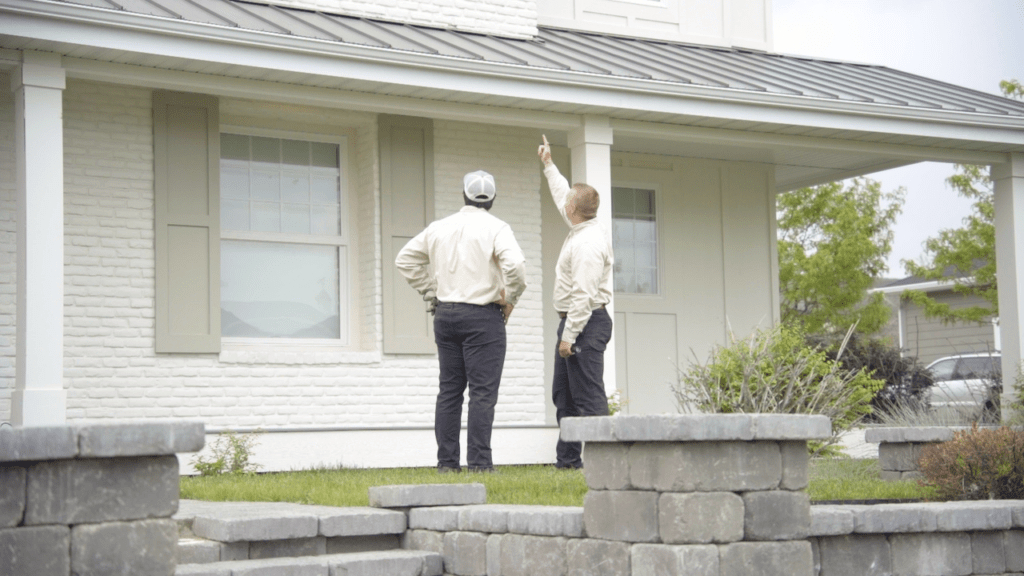 Service Specialist Performing Eave Inspection