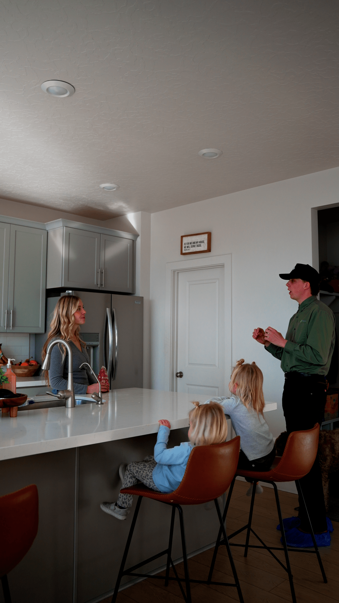 Natures Balance Pest Control Service Specialist speaking with utah homeowner about pest issue inside home