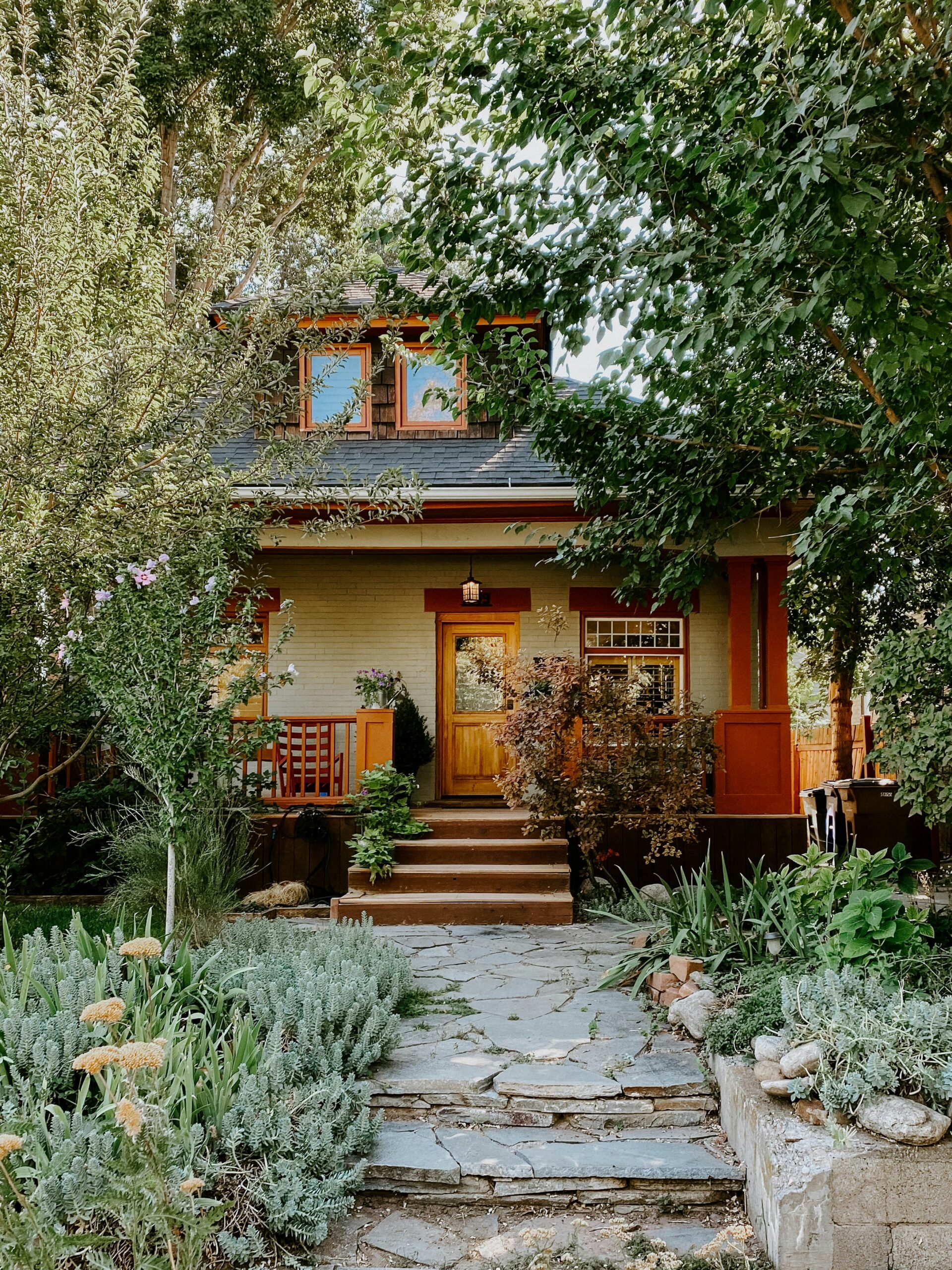 Cottonwood Heights Home with greenery and stone pathway