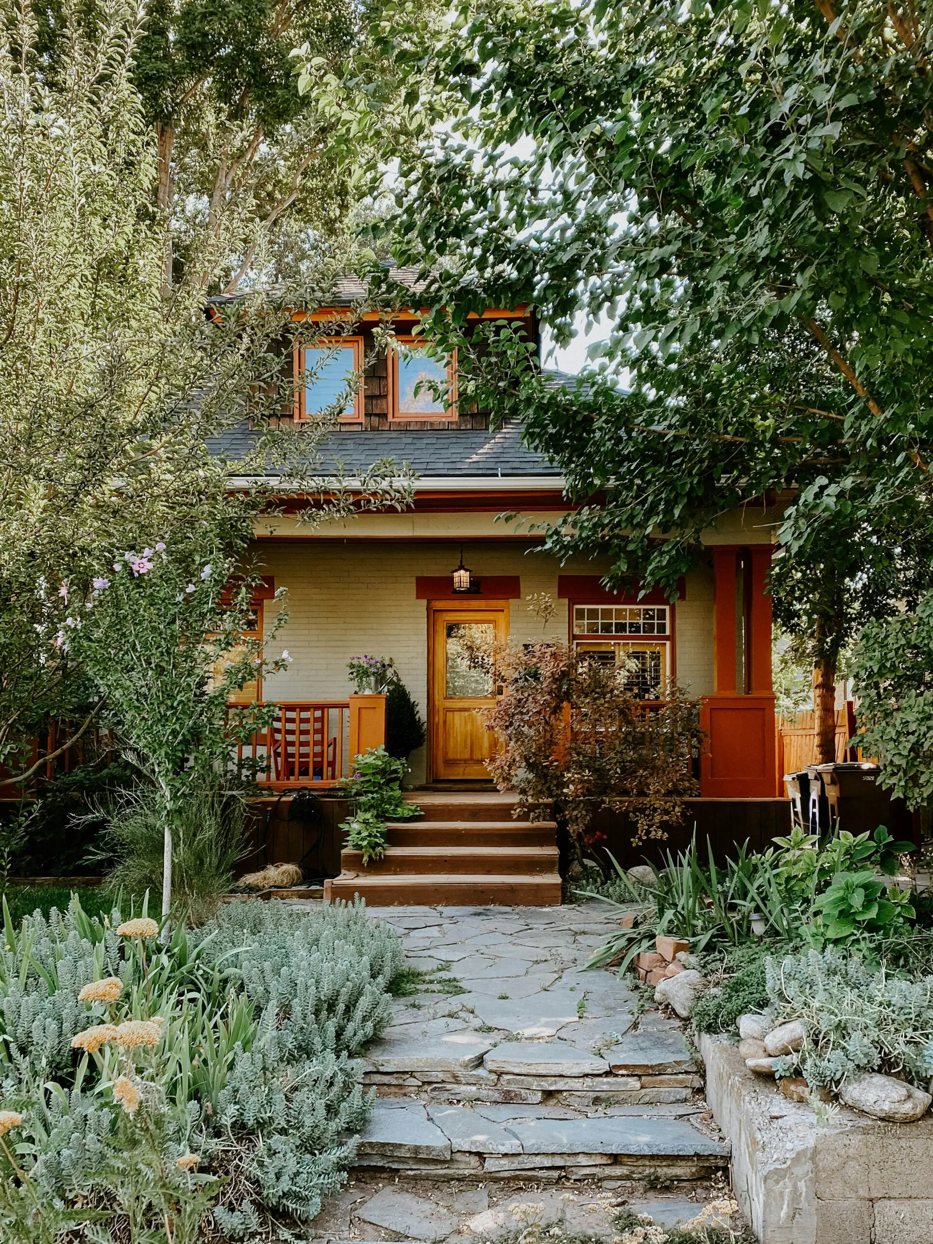 Cottonwood Heights Home with greenery and stone pathway
